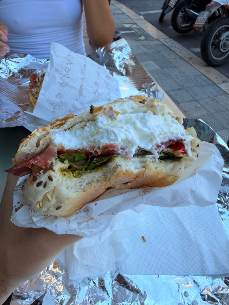 A panino with burrata and prosciutto