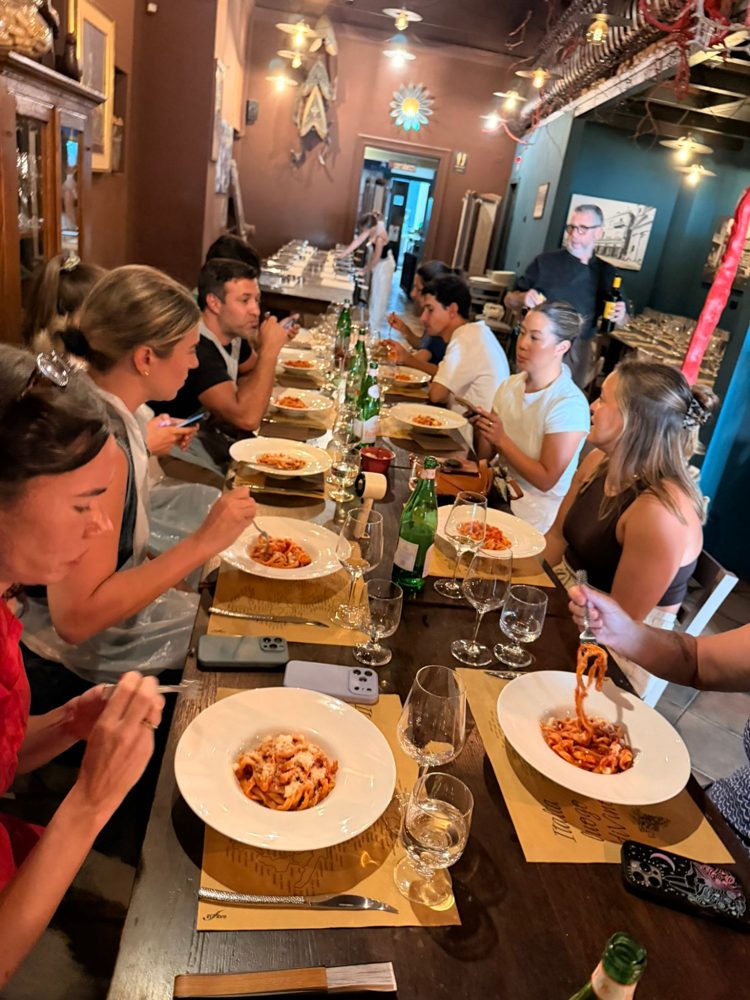 Plates of pasta down a long table