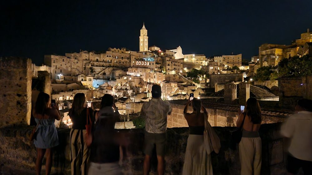 Members photographing the Sassi of Matera lit up at night